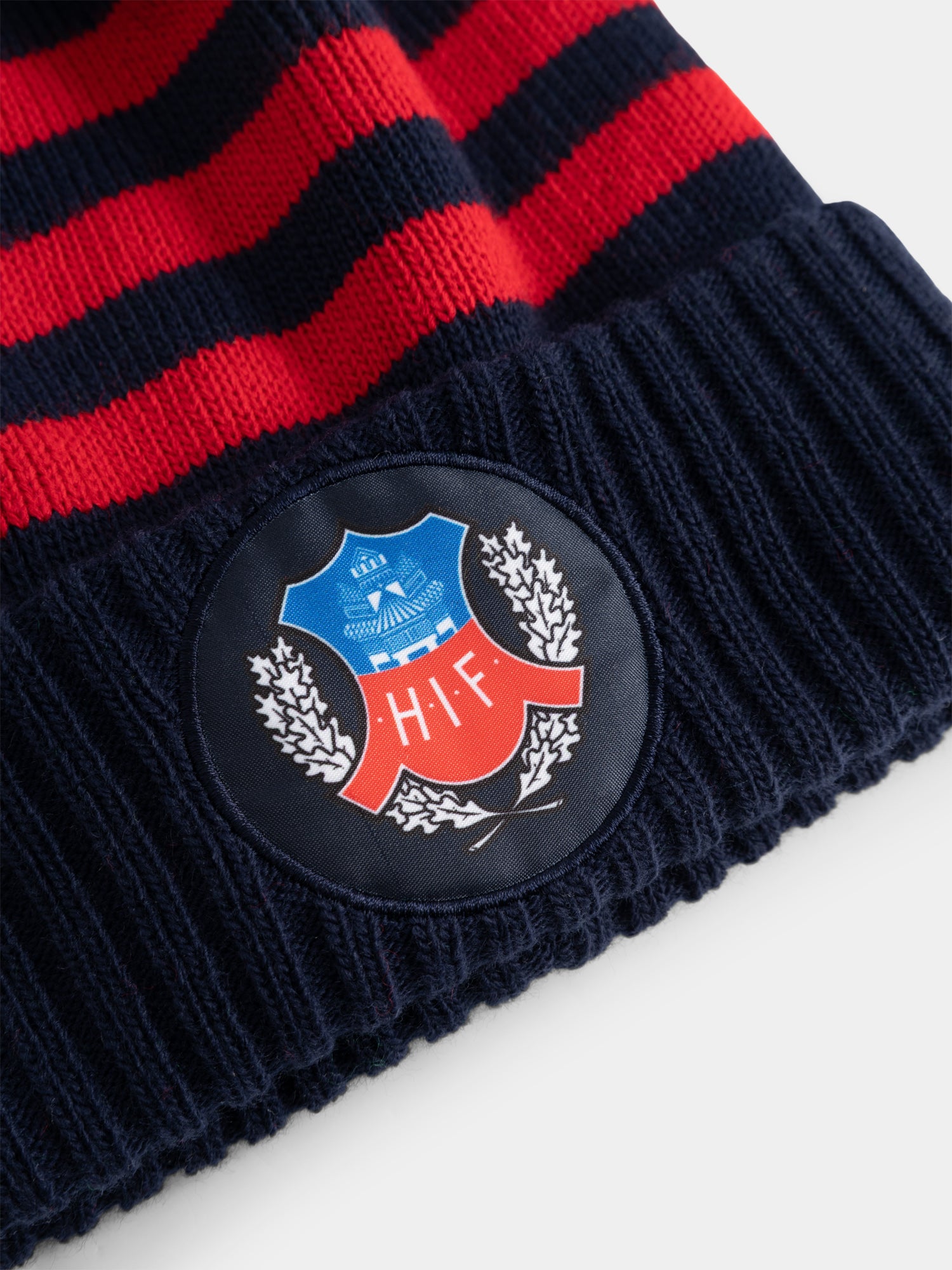 Stickad mössa Emblem
